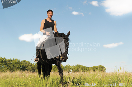 Image of young man and horse