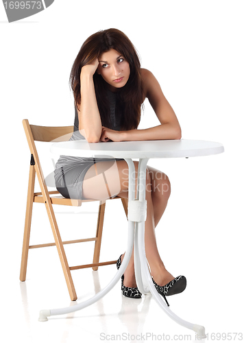 Image of Girl sitting on a chair