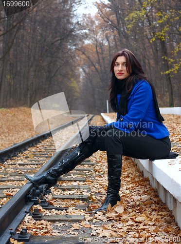 Image of Young woman near the rails