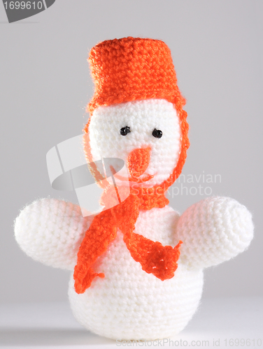 Image of White snowman at the grey background