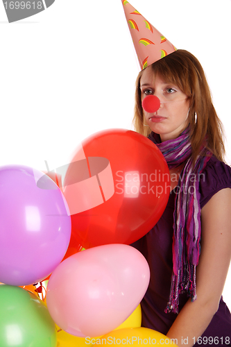 Image of Sad girl with colored baloons