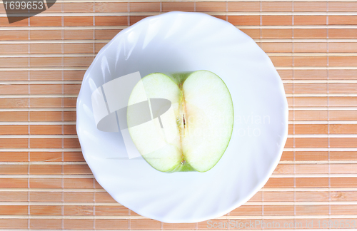Image of Half of apple on the plate