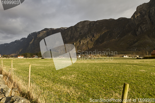 Image of grassland with mountains in background