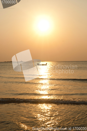 Image of tropical island sunset boat