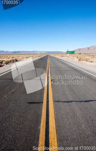 Image of long highway through desert