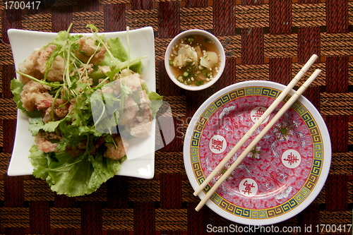 Image of Asian over brown table with chopsticks