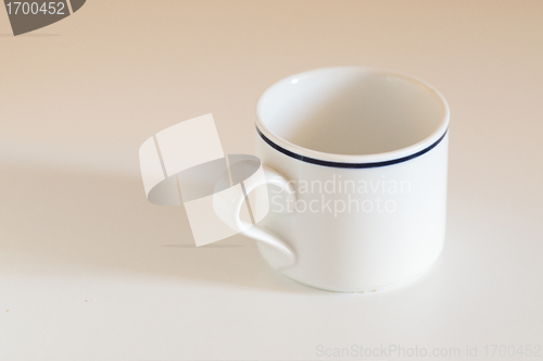 Image of White breakfast cup over table