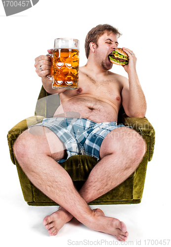 Image of fat man eating hamburger