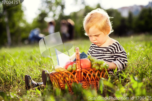 Image of boy looks at a book