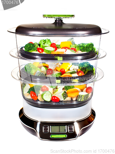 Image of Healthy cooking, steam cooker with vegetables