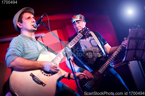 Image of musician plays a guitar