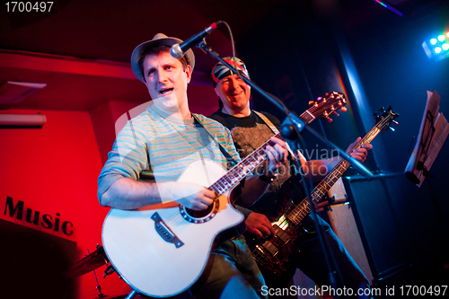 Image of musician plays a guitar