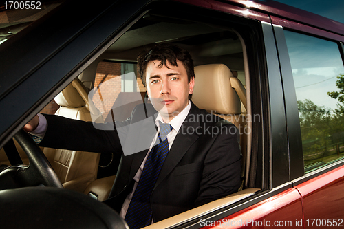 Image of man at the wheel the car