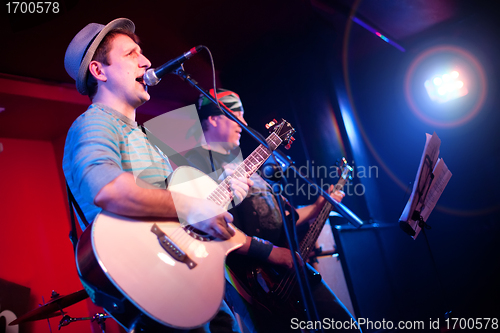 Image of musician plays a guitar