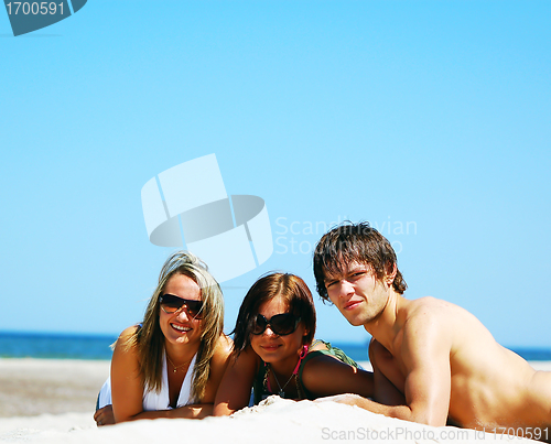 Image of Young friends on the summer beach