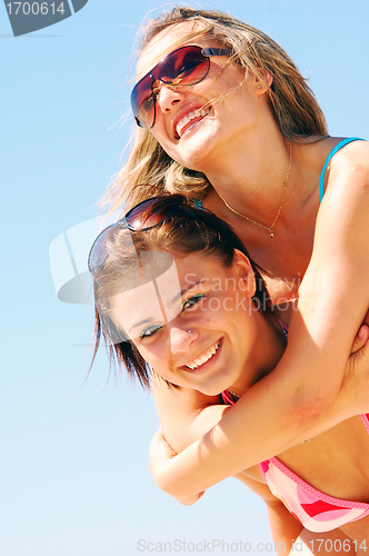 Image of Young women on the summer beach