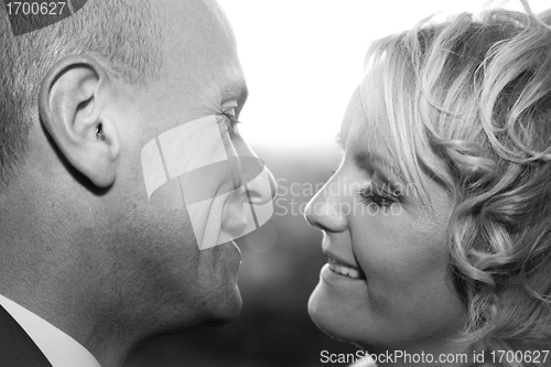 Image of Happy bride and groom kissing