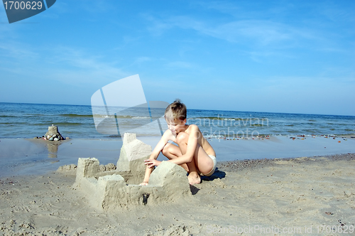 Image of Boy playing on the beach