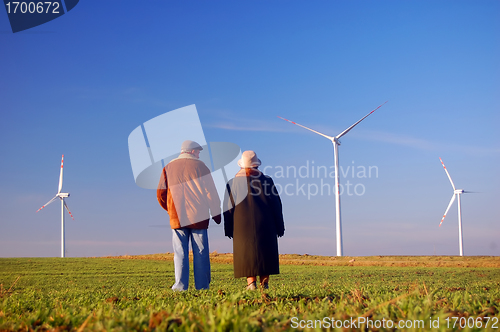 Image of Seniors' couple and wind turbines