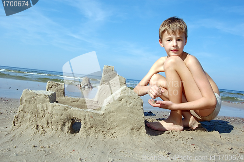 Image of Boy playing on the beach