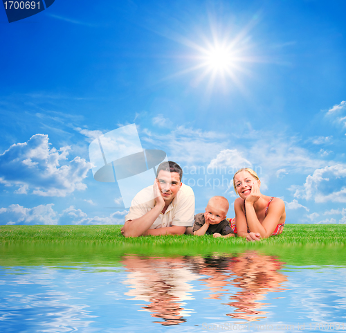 Image of Happy family together on grass