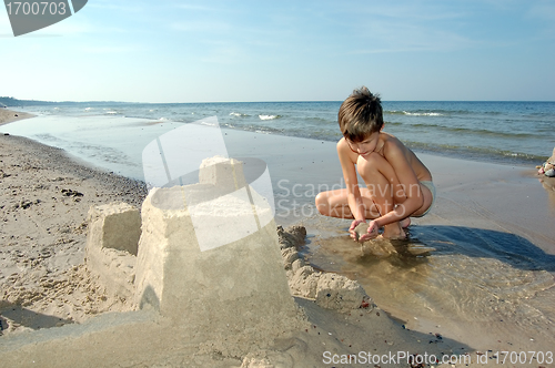 Image of Boy playing on the beach