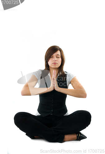 Image of Businesswoman relaxing, meditating