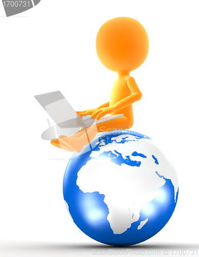 Image of Gold man sitting on the globe with laptop