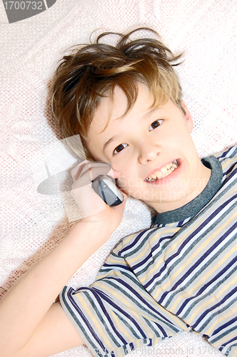 Image of Teen boy talking on cell phone