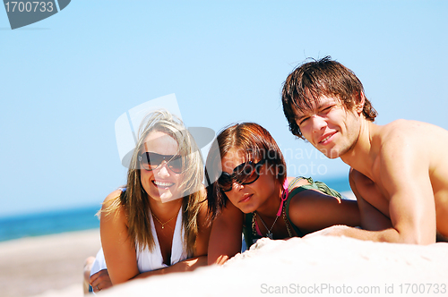 Image of Young friends on the summer beach