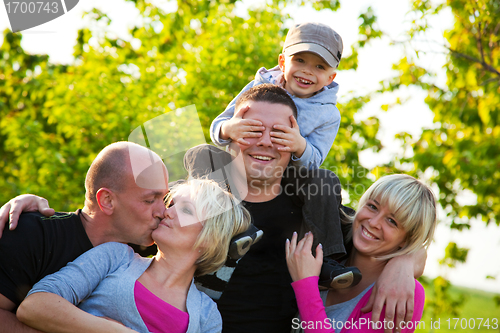 Image of Family friends having fun, playing, smiling outdoors