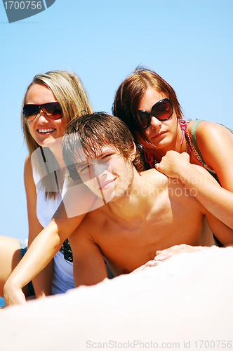 Image of Young friends on the summer beach