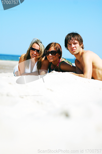 Image of Young friends on the summer beach