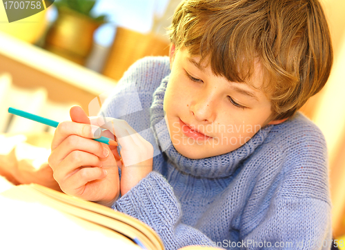 Image of Boy doing homework