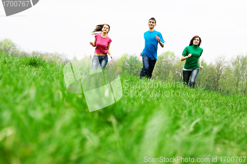 Image of Happy friends jumping