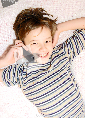 Image of Teen boy talking on cell phone