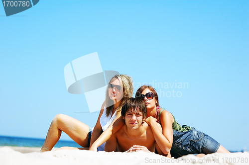 Image of Young friends on the summer beach