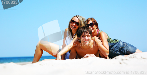 Image of Young friends on the summer beach