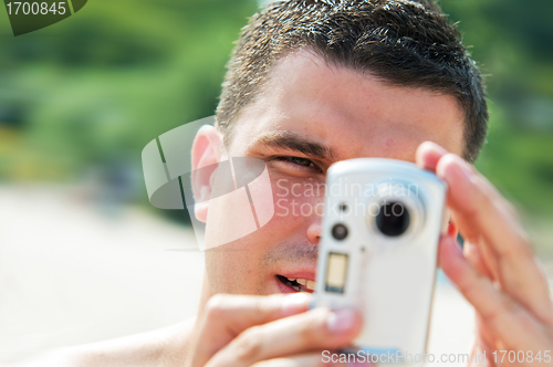 Image of Man taking picture on holidays