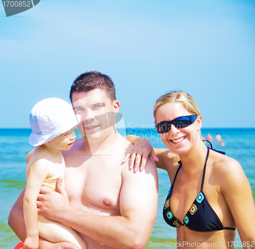 Image of Happy family on the beach