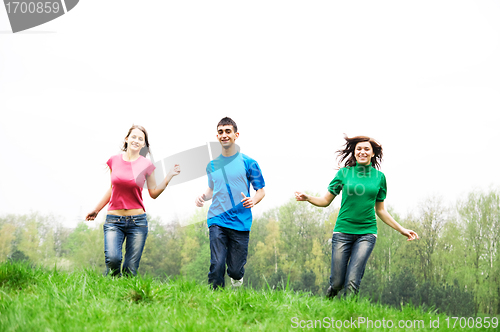 Image of Happy friends jumping