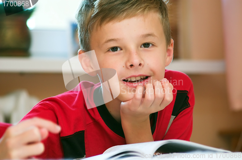 Image of Boy reading book portrait