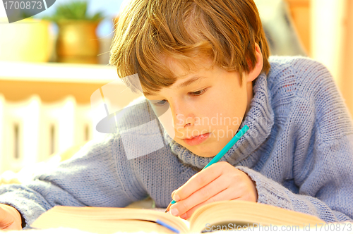 Image of Boy doing homework