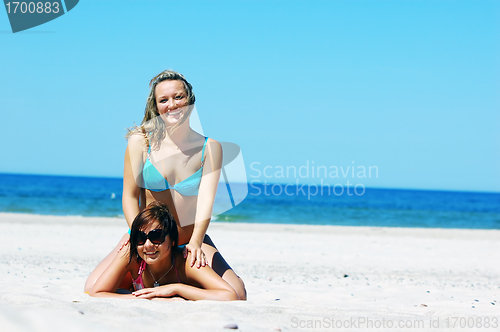 Image of Young girls on the summer beach