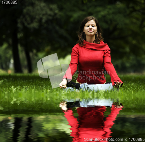 Image of Young woman doing yoga
