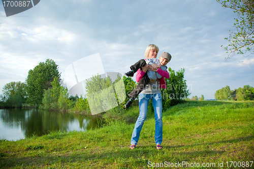Image of Young mother playing with her child 