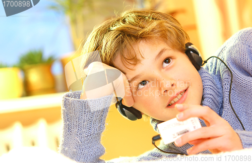 Image of Boy listen to music