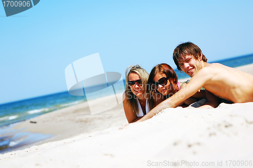 Image of Young friends on the summer beach