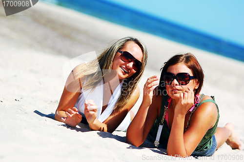 Image of Young girls on the summer beach