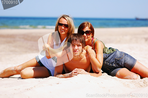 Image of Young friends on the summer beach